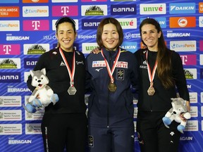 From left, second place Quebec's Valérie Maltais, first place Japan's Momoka Horikawa and third place Canada's Ivanie Blondin celebrate at the end of the Mass Start Final Women event of the World Cup Speed Skating in Tomaszow Mazowiecki, Poland, on Sunday, Feb. 19, 2023.