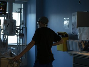 An assistant nursing professor at the University of New Brunswick says there is a crisis-level shortage of sexual assault nurse examiners in the country. A nurse tends to a patient at the Bluewater Health Hospital in Sarnia, Ont., on Wednesday, Jan, 26, 2022. THE CANADIAN PRESS/Chris Young