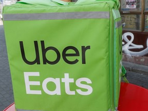 FILE PHOTO: An Uber Eats food delivery courier rides a scooter in central Kiev, Ukraine September 9, 2019. REUTERS/Valentyn Ogirenko - RC13EADEABC0/File Photo ORG XMIT: FW1