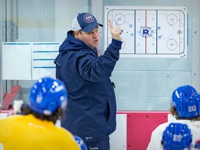 Laval Rocket head coach Jean-François Houle instructs players during practice at the Place Bell Sports Complex in Laval.