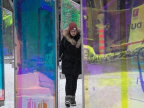 Lise George walks through the Luminotherapie display called Prismatica at Place des Festival March 2, 2023.