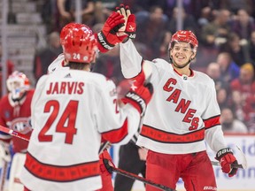 Hurricanes' Jesperi Kotkaniemi is congratulated by teammates after scoring the winning goal in a shootout against the Canadiens at the Bell Centre Tuesday night.