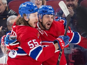 Montreal Canadiens' Michael Pezzetta, left, and Alex Belzile celebrate Belzile's goal during first period against the Carolina Hurricanes in Montreal on March 7, 2023.