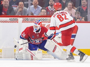 Carolina Hurricanes' Jesperi Kotkaniemi scores the game-winning goal against Montreal Canadiens' Jake Allen in a shootout during a National Hockey League game in Montreal Tuesday March 7, 2023.
