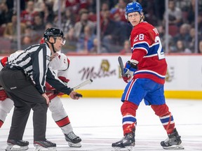 Montreal Canadiens centre Christian Dvorak looks back at his defenceman while lining up for a faceoff against the Carolina Hurricanes in Montreal on March 7, 2023.