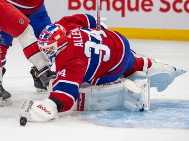 Canadiens goaltender Jake Allen dives for a loose puck during the second period of a National Hockey League game against the Carolina Hurricanes in Montreal Tuesday March 7, 2023.