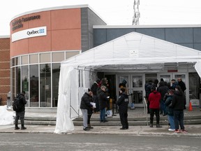 People line up at a Montreal SAAQ outlet. "There have been some bugs" with the transition to a digital platform, Quebec Transport Minister Geneviève Guilbault conceded March 10.
