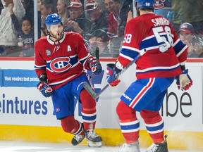 Canadiens' Josh Anderson celebrates with David Savard after scoring during the second period of a National Hockey League game against the New York Rangers in Montreal Thursday March 9, 2023.