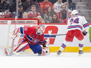 Canadiens' Sam Montembault makes a save on a shot by New York Rangers' Kaapo Kakko during the shootout of a National Hockey League game in Montreal Thursday March 9, 2023.