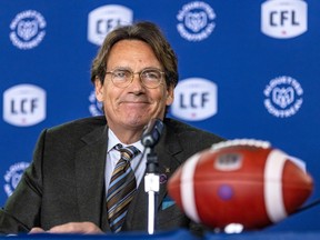 Quebecor CEO Pierre-Karl Péladeau smiles after being introduced as the new owner of the Montreal Alouettes by Canadian Football League commissioner Randy Ambrosie at a press conference in Montreal on Friday, March 10, 2023.