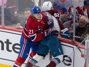 Montreal Canadiens defenceman Kaiden Guhle checks Colorado Avalanche left-wing Artturi Lehkonen during first period at the Bell Centre in Montreal on March 13, 2023.