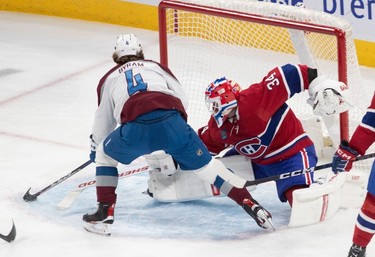 Colorado Avalanche defenceman Bowen Byram (4) scores against Montreal Canadiens goaltender Jake Allen (34) during first-period NHL action at the Bell Centre in Montreal on Monday March 13, 2023.