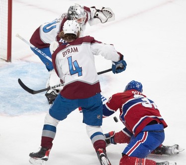 Montreal Canadiens centre Rem Pitlick (32) can't get to the puck in front of Colorado Avalanche goaltender Alexandar Georgiev (40) during first-period NHL action at the Bell Centre in Montreal on Monday March 13, 2023.