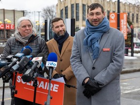 Guillaume Cliche-Rivard, right, newly elected Québec solidaire MNA for Saint-Henri—Saint-Anne, answers questions at a news conference with QS co-spokespeople Manon Massé and Gabriel Nadeau-Dubois in Montreal, Tuesday March 14, 2023.
