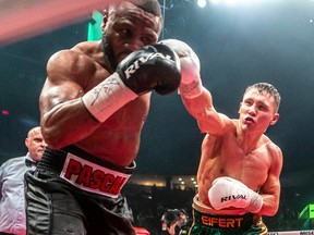 Jean Pascal of Laval turns from a punch by Michael "Diesel" Eifert, right, during their 12-round fight at Place Bell in Laval on Thursday, March 16, 2023.