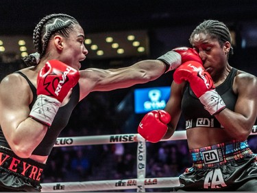 Caroline Veyre, left, jabs Annaelle Angerville during their six-round fight at Place Bell in Laval on Thursday ,March 16, 2023.