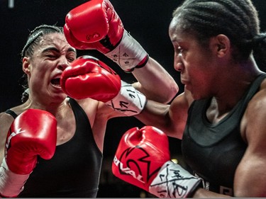 Caroline Veyre, left, defeated Annaelle Angerville during their six-round fight at Place Bell in Laval on Thursday, March 16, 2023.