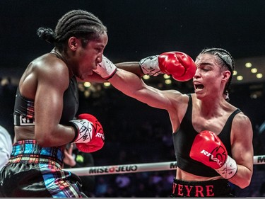 Caroline Veyre, right, defeated Annaelle Angerville during their six-round fight at Place Bell in Laval on Thursday, March 16, 2023.