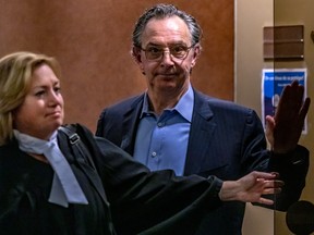 Florent Francoeur leaves the courtroom with his lawyer, Lucie Joncas, at the Palais de Justice in Montreal on Friday, March 17, 2023.