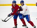 Laval Rocket's Jayden Struble, right, puts pressure on Lucas Condotta during practice in Laval on Monday March 20, 2023.