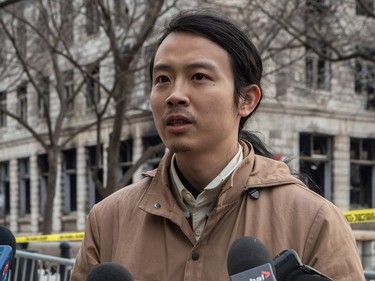Yukun Zeng speaks to reporters about his missing friend An Wu at the scene of the fire in Old Montreal on Tuesday March 21, 2023.