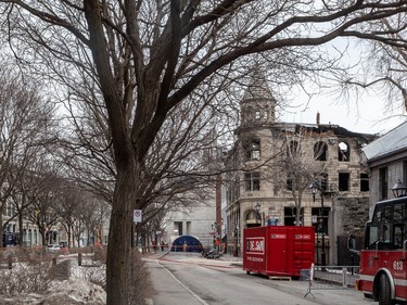 Firefighters continued to investigate the scene of the fire in Old Montreal on Tuesday.