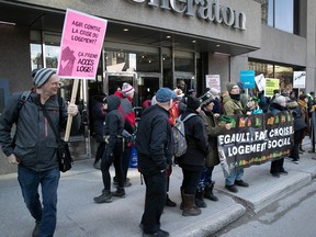A small group of protesters from FRAPRU took to the street in front of the Sheraton Centre on Friday to protest for more social housing while Quebec Finance Minister Eric Girard was addressing the Montreal Board of Trade inside.