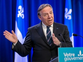Quebec Premier François Legault holds a press conference in Montreal on Friday, March 24, 2023, to comment on the federal government's agreement with the United States to close Roxham Road.