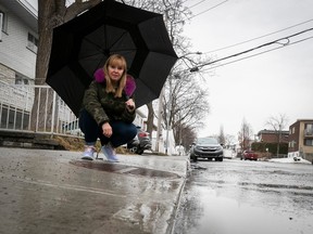 There is a storm drain on the incline of the sidewalk outside Franca Bucaro's St-Léonard home. She feels the city's work to help prevent flooding is a Band-Aid solution.