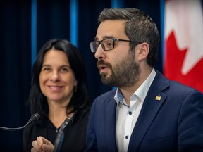 Mayor Valérie Plante listens to Robert Beaudry, executive committee member in charge of urban planning, at a press conference at City Hall in Montreal Wednesday, March 29, 2023.