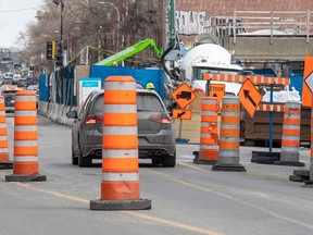 Orange cones divert traffic around the construction site at the Outremont métro station on Van Horne Ave. in Montreal on Thursday, March 30, 2023.