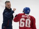Canadiens head coach Martin St. Louis pumps fists with Alex Belzile during first day of training camp in Brossard on Thursday Sept. 22, 2022. Players say St. Louis focuses on how to play away from the puck, and gives a lot of leeway to players.