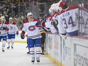 Anthony Richard #90 of the Montreal Canadiens celebrates with teammates on the bench after scoring a goal in the third period during the game against the Pittsburgh Penguins at PPG PAINTS Arena March 14, 2023 in Pittsburgh.