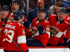 Carter Verhaeghe gets congratulated by his Florida Panthers teammates after scoring first-period goal against the Canadiens Thursday night at FLA Live Arena in Sunrise, Fla.