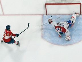 Carter Verhaeghe of the Florida Panthers scores a first-period goal past Montreal Canadiens goalie Sam Montembeault on March 16, 2023, in Sunrise, Fla.