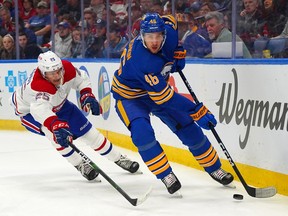 Ilya Lyubushkin #46 of the Buffalo Sabres skates with the puck as Denis Gurianov #25 of the Montreal Canadiens pursues during the first period at KeyBank Center on March 27, 2023 in Buffalo, New York.