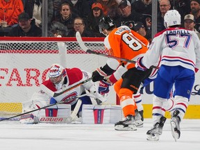 Cayden Primeau #30 of the Montreal Canadiens makes a save in front of Joel Farabee #86 of the Philadelphia Flyers in the first period at the Wells Fargo Center on March 28, 2023 in Philadelphia.