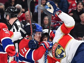 Brendan Gallagher #11 of the Montreal Canadiens grabs a hold of Marc Staal #18 of the Florida Panthers during the first period at Centre Bell on March 30, 2023 in Montreal.