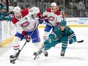 Canadiens' Josh Anderson keeps the puck away from Sharks'  Nico Sturm while Canadiens' Mike Matheson trails the play Tuesday night in San Jose.