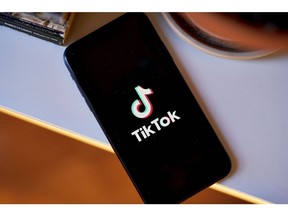 The TikTok logo on a smartphone arranged in the Brooklyn borough of New York, US, on Thursday, March 9, 2023. The U.S. is moving closer to restricting access to the popular video-sharing app TikTok, with Senate Intelligence Committee Chairman Mark Warner set to unveil a bill Tuesday that the Biden administration is poised to support, according to people familiar with the issue.