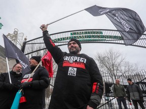 Striking Notre-Dame-des-Neiges cemetery operations and maintenance workers and their supporters gathered outside the cemetery entrance on Saturday, March 18, 2023, in Montreal to protest against the closing of the cemetery. The strike started in January. The conflict continues leaving families unable to bury loved ones or visit the graves of those previously interred.