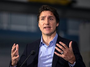 Prime Minister Justin Trudeau, seen speaking to the media in a file photo from Jan. 25, 2023, owes it to this country's almost two million Chinese Canadians to hold a full public inquiry into Beijing's interference in Canadian affairs, writes Tasha Kheiriddin.