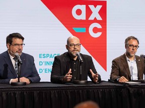 Richard Chénier, Centech’s general manager, speaks Friday, March 31, 2023, at a press conference to announce the creation of Ax-C. Seated next to him are François Gagnon, head of École de Technologie Supérieure, on the left of the picture, and city of Montreal executive committee member Luc Rabouin, on the right.