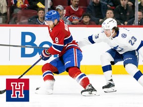 Canadiens Mike Matheson spins away from check by the Tampa Bay Lightning's Michael Eyssimont on March 21, 2023.