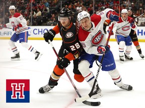 Nathan Beaulieu of the Anaheim Ducks and Jesse Ylonen of the Montreal Canadiens collide as they skate for the puck during the first period on March 3, 2023