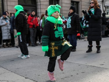 Beatrice Plourde from Moran Academy of Irish dancing shows off some steps during the St. Patrick's Day Parade in Montreal on Sunday, March 19, 2023.