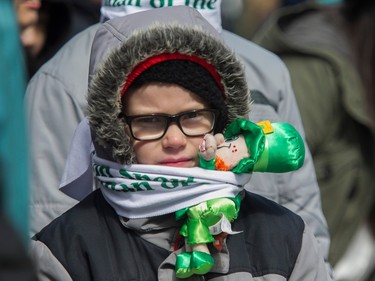 Logan Cambridge watches the St. Patrick's Day Parade in Montreal on Sunday, March 19, 2023.