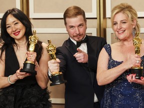 Judy Chin, Adrien Morot of Montreal and Anne Marie Bradley pose with the Oscar for Best Makeup and Hairstyling for The Whale in the Oscars photo room at the 95th Academy Awards in Hollywood, Los Angeles on Sunday, March 12, 2023.