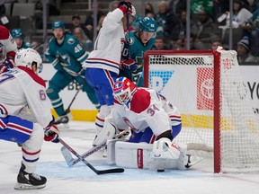 Montreal Canadiens goaltender Jake Allen (34) makes a save against the San Jose Sharks during the first period of an NHL hockey game in San Jose, Calif., Tuesday, Feb. 28, 2023.