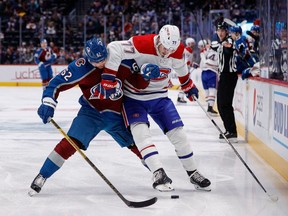 Colorado Avalanche left wing Artturi Lehkonen (62) and Montreal Canadiens centre Kirby Dach (77) battle for the puck in the first period in Denver on December 21, 2022.